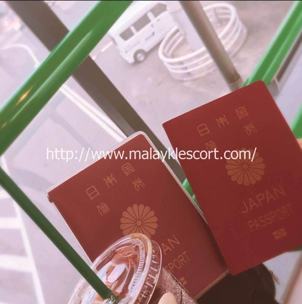 Two Japan passports with a drink. Hilda, a Japan Girl, may be traveling.