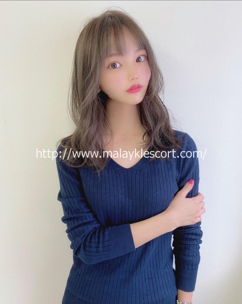 Hilda, a Japan Girl, with stylish hair and a blue top. Malay Escort Girl Service
