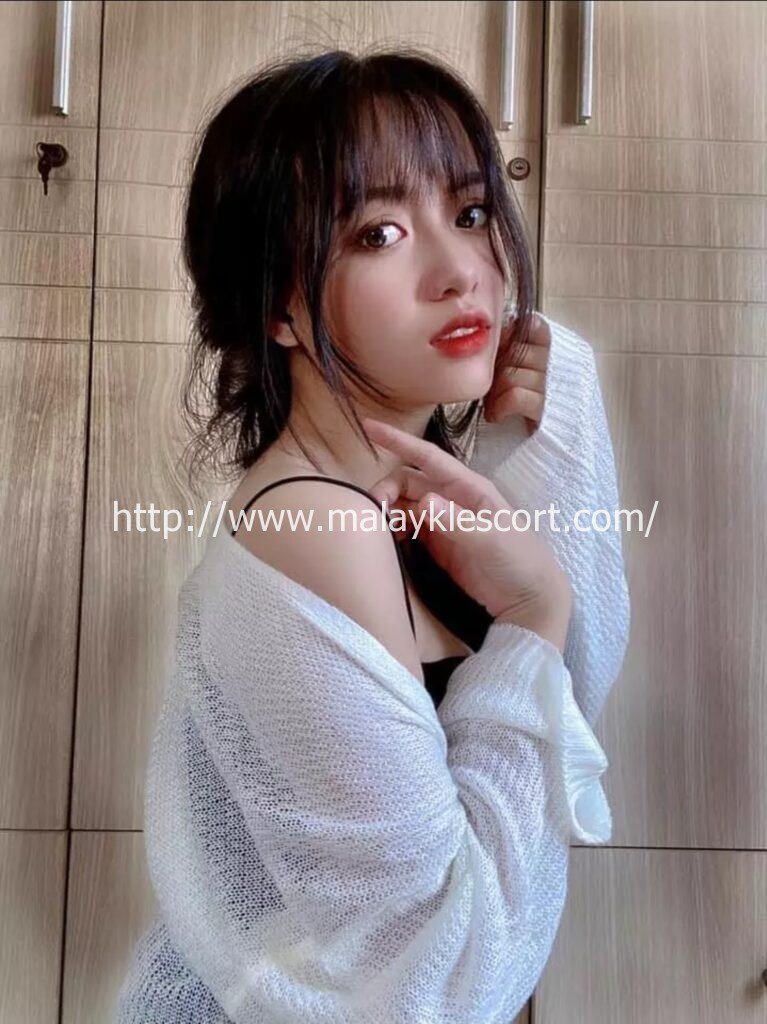 Mandy, a beautiful Vietnam Girl with red lips, in a white sweater, KL Girl Service.