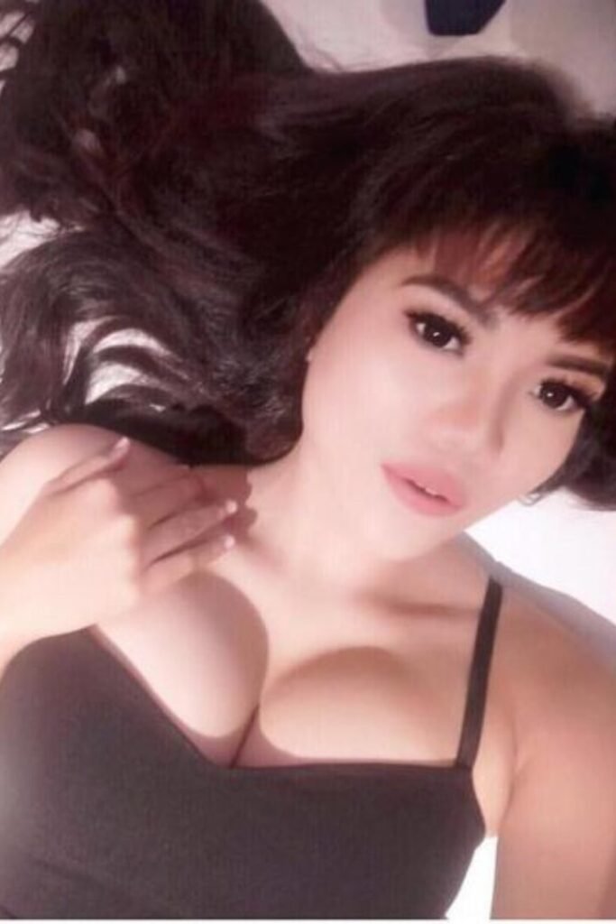 Cola, Indonesia Girl, lying down, wearing a black top, with dark hair. Malay Escort, KL Escort, Malaysia Escort, Kuala Lumpur Escort