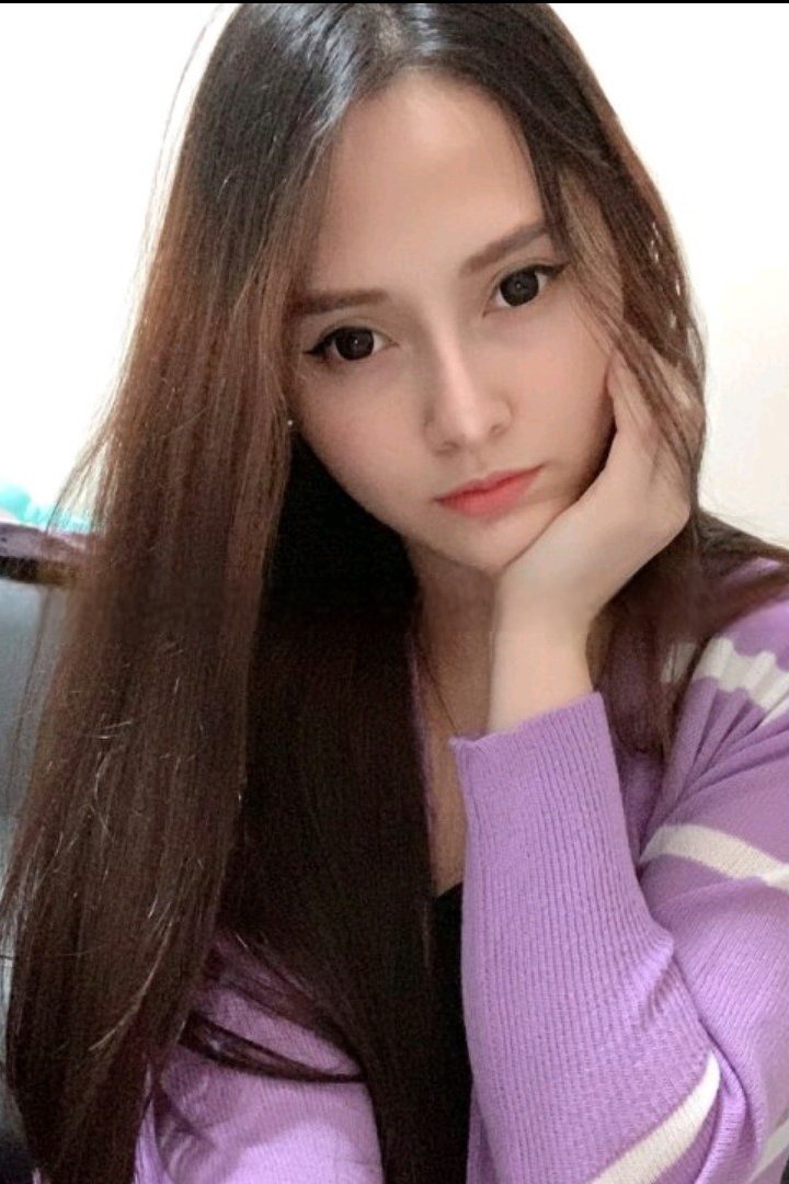 Siti, a Malay girl, in a purple sweater. Malay Escort, KL Call Girl, Outcall Girl.